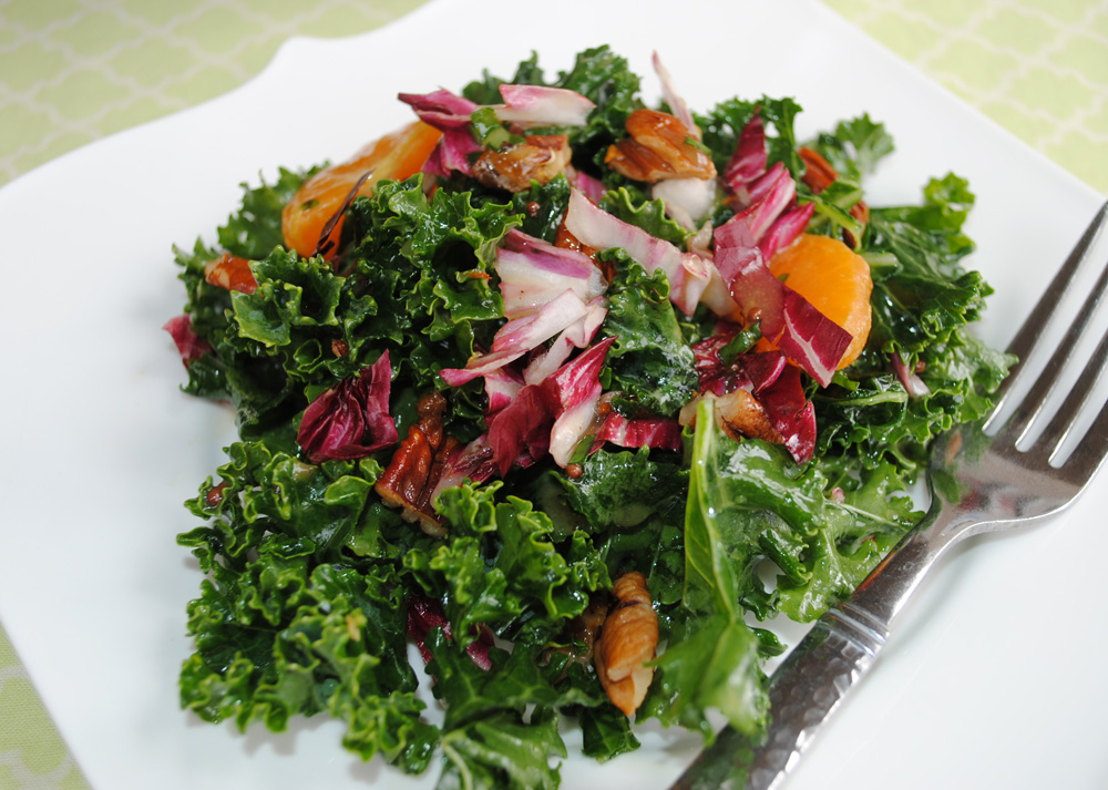 Delicious, fruity kale salad with mandarin oranges, cranberries, and candied pecans | www.thatwasvegan.com